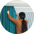 woman-hangs-curtain-fashion-room-modified